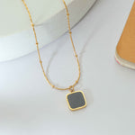 Golden Necklace with Black Stone