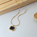 Golden Necklace with Black Stone